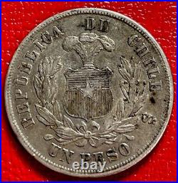 1883 Chile Shield And Condor One Peso Silver World Coin. ENN Coins