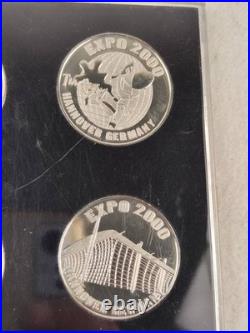 Set of 4 coins from the World Exhibition 2000 in Hannover, Germany