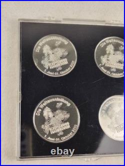Set of 4 coins from the World Exhibition 2000 in Hannover, Germany