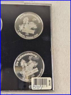 Set of 4 coins from the World Exhibition 2000 in Hannover, Germany